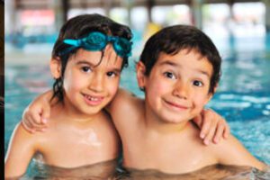 kids swimming in a pool