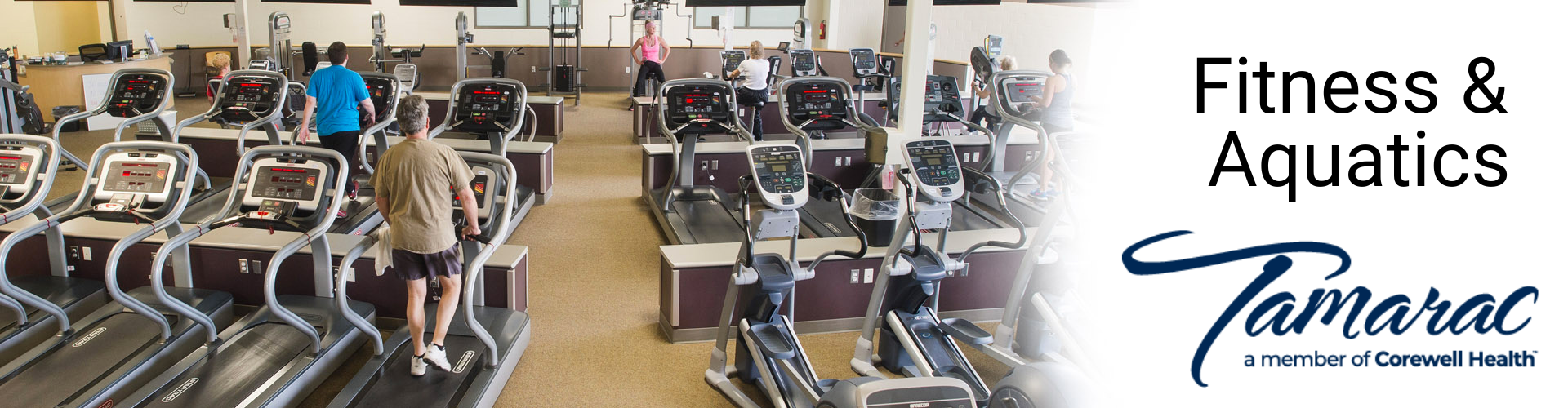 fitness equipment room with people using equipment